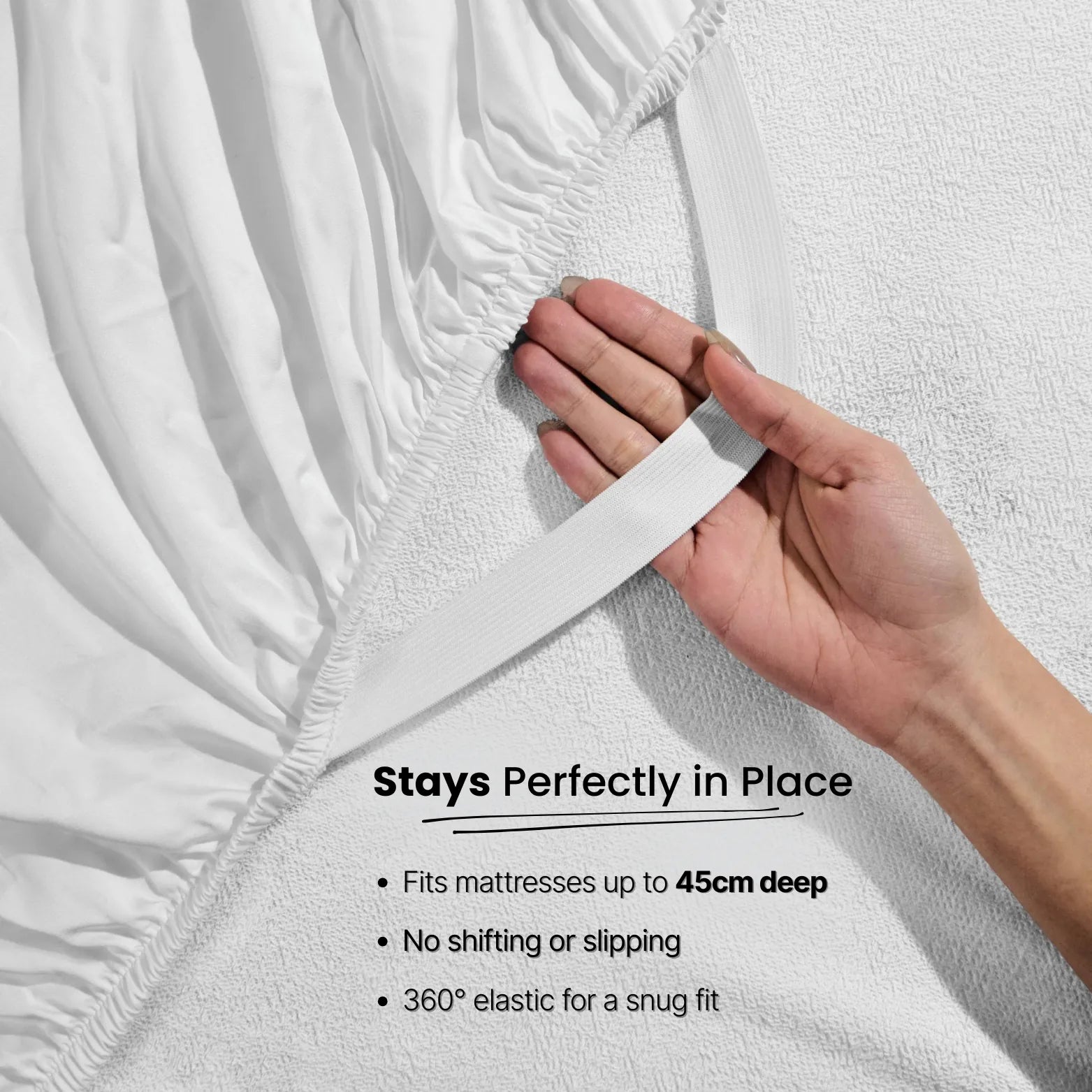 Hand touching silky smooth eucalyptus bamboo fabric. Buttery-soft, breathable bed sheets offering luxury comfort and moisture-wicking sleep for hot nights