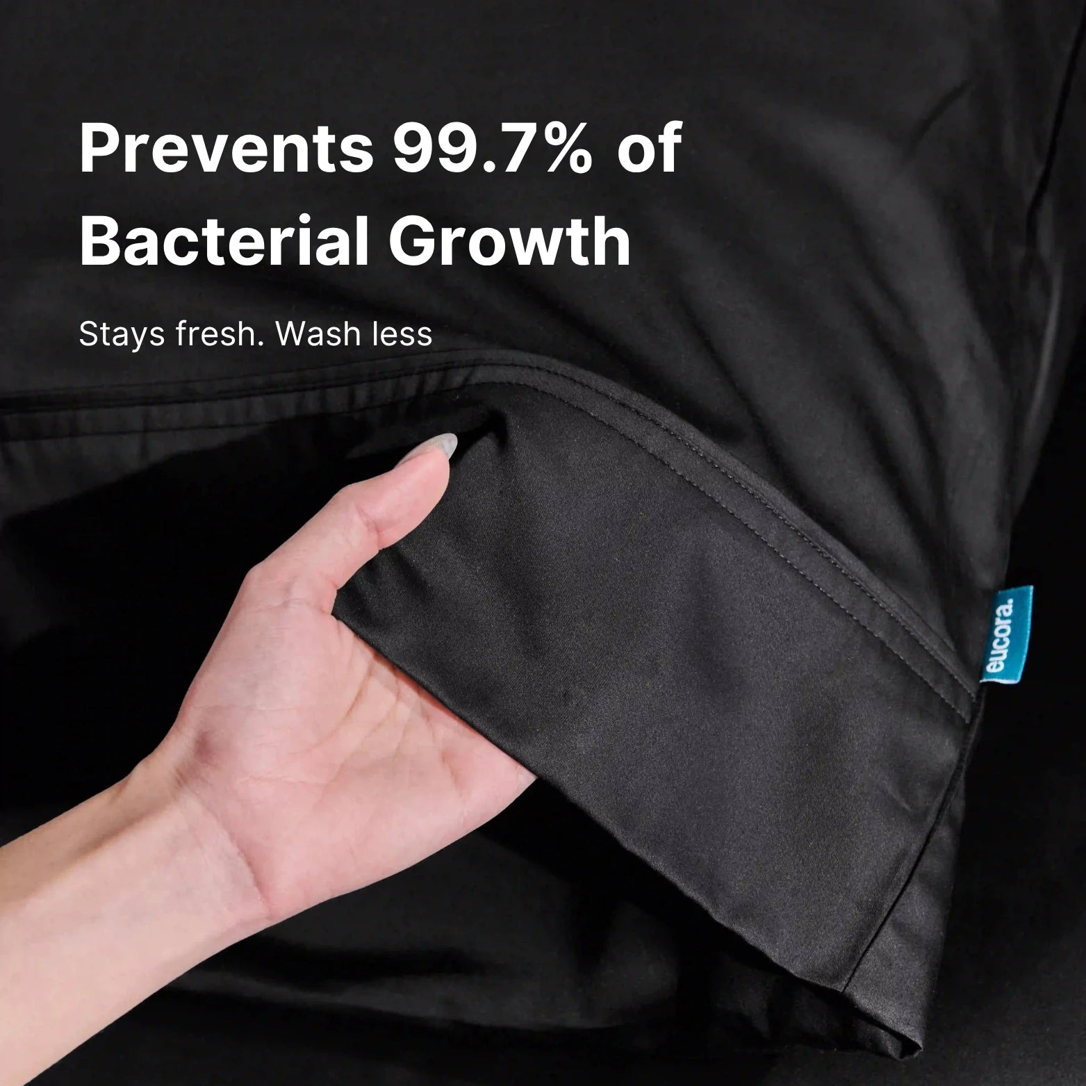 etailed view of deep pocket black bamboo fitted sheet. Stretch edges ensure perfect fit and premium eucalyptus-infused comfort.