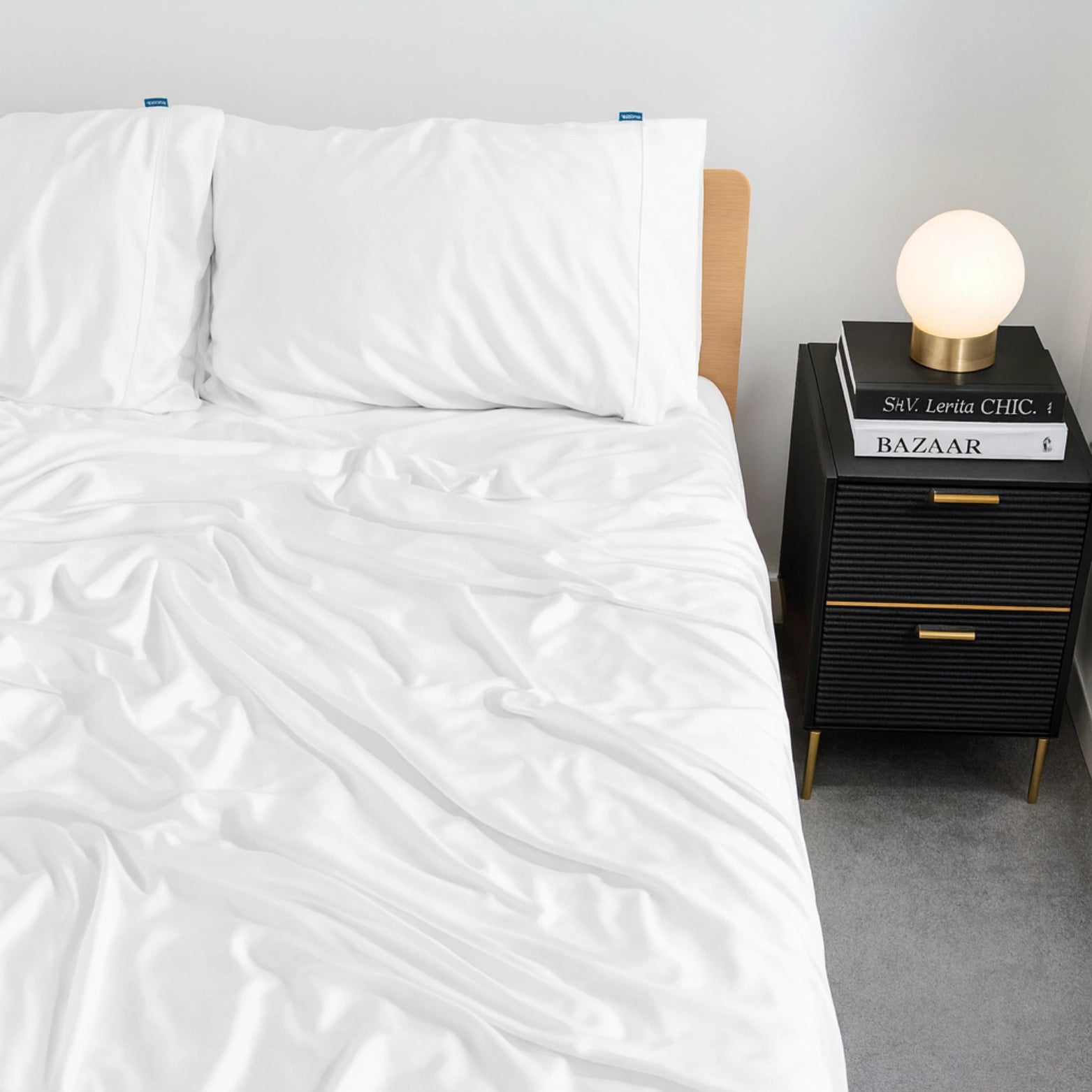 Luxury white bamboo bed sheets infused with eucalyptus oil, styled on a modern bed. Soft, cooling, and breathable bedding set for hot sleepers in Australia and the UK.
